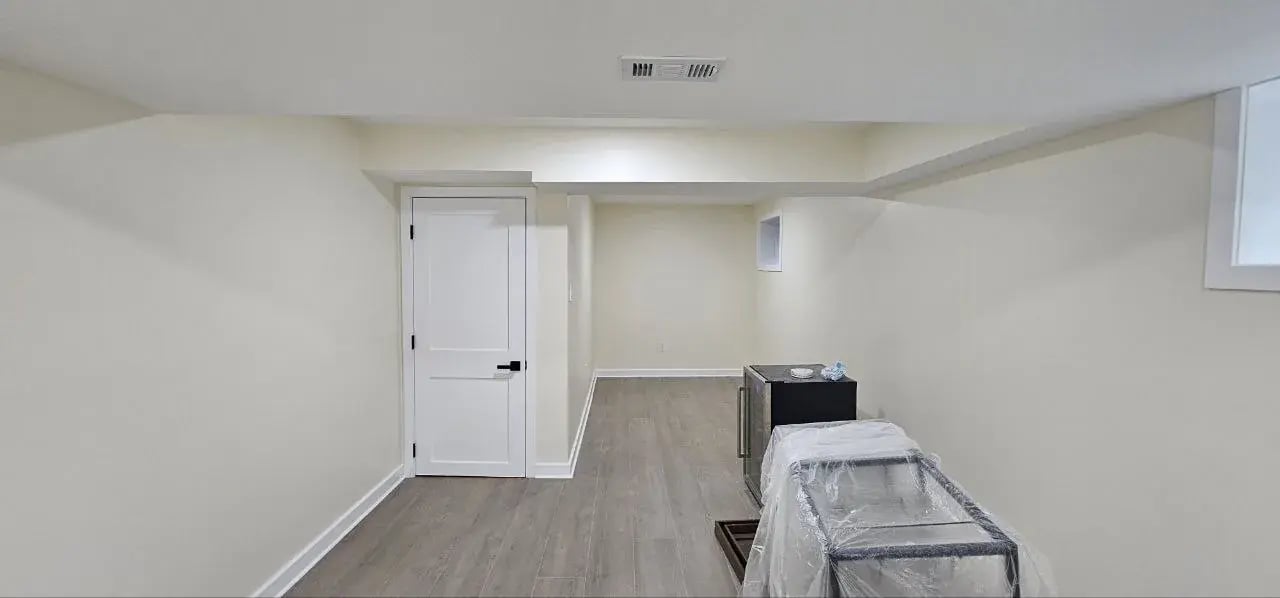 Finished basement hallway with new door