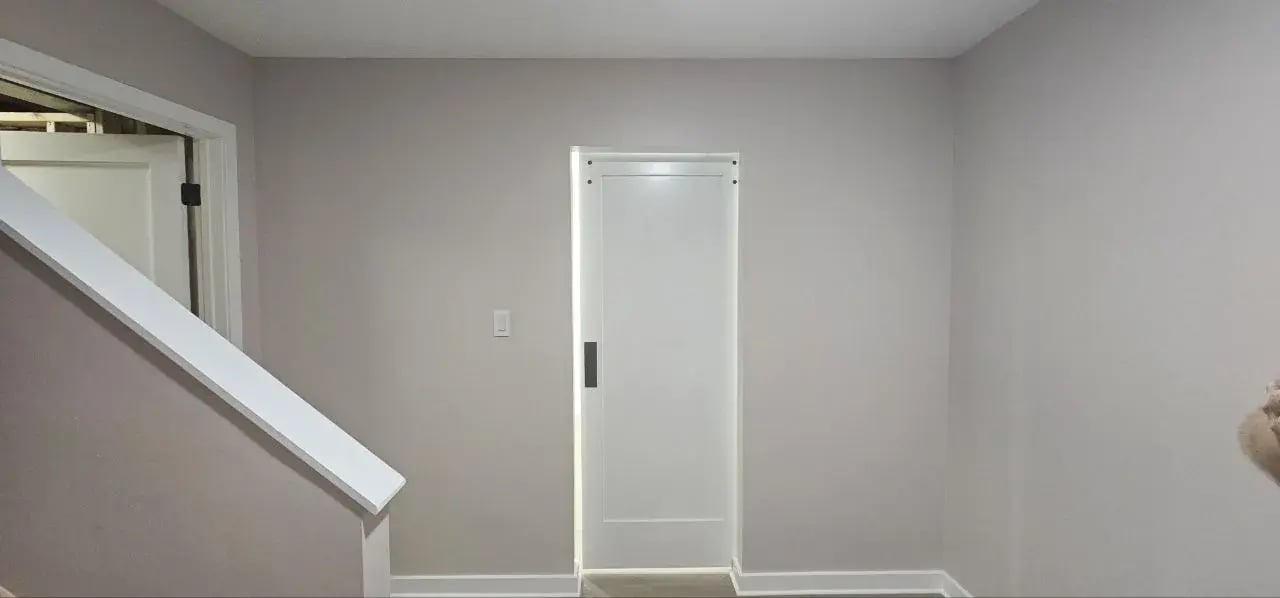 Basement hallway with new interior door