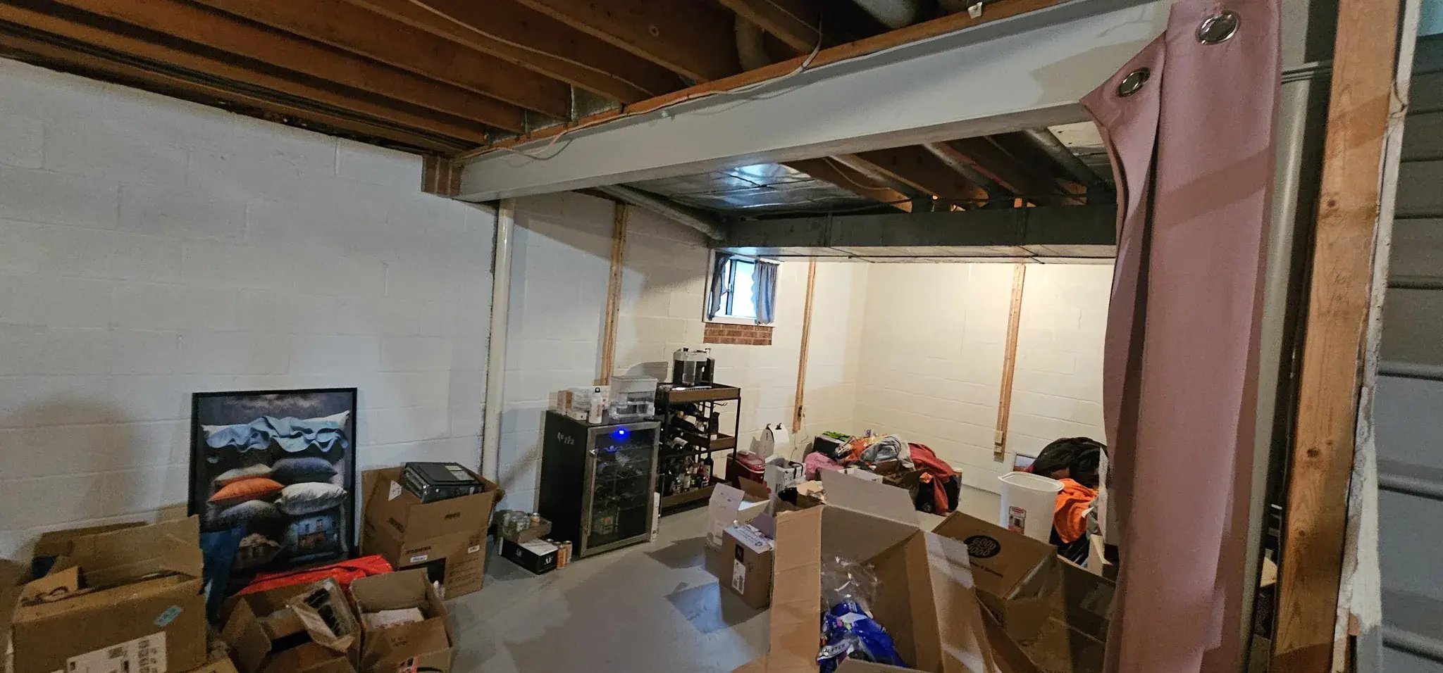 Unfinished basement area used for storage