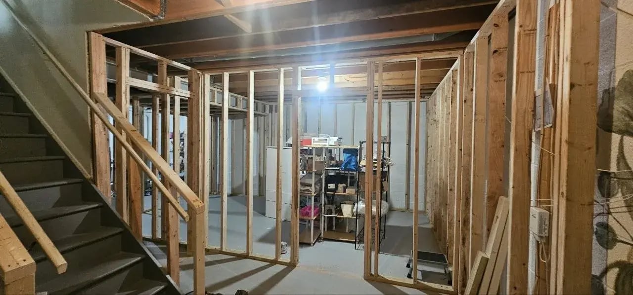 Framed hallway next to the basement stairs