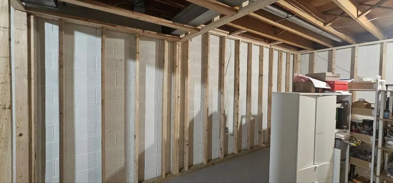 Framed basement rooms before drywall