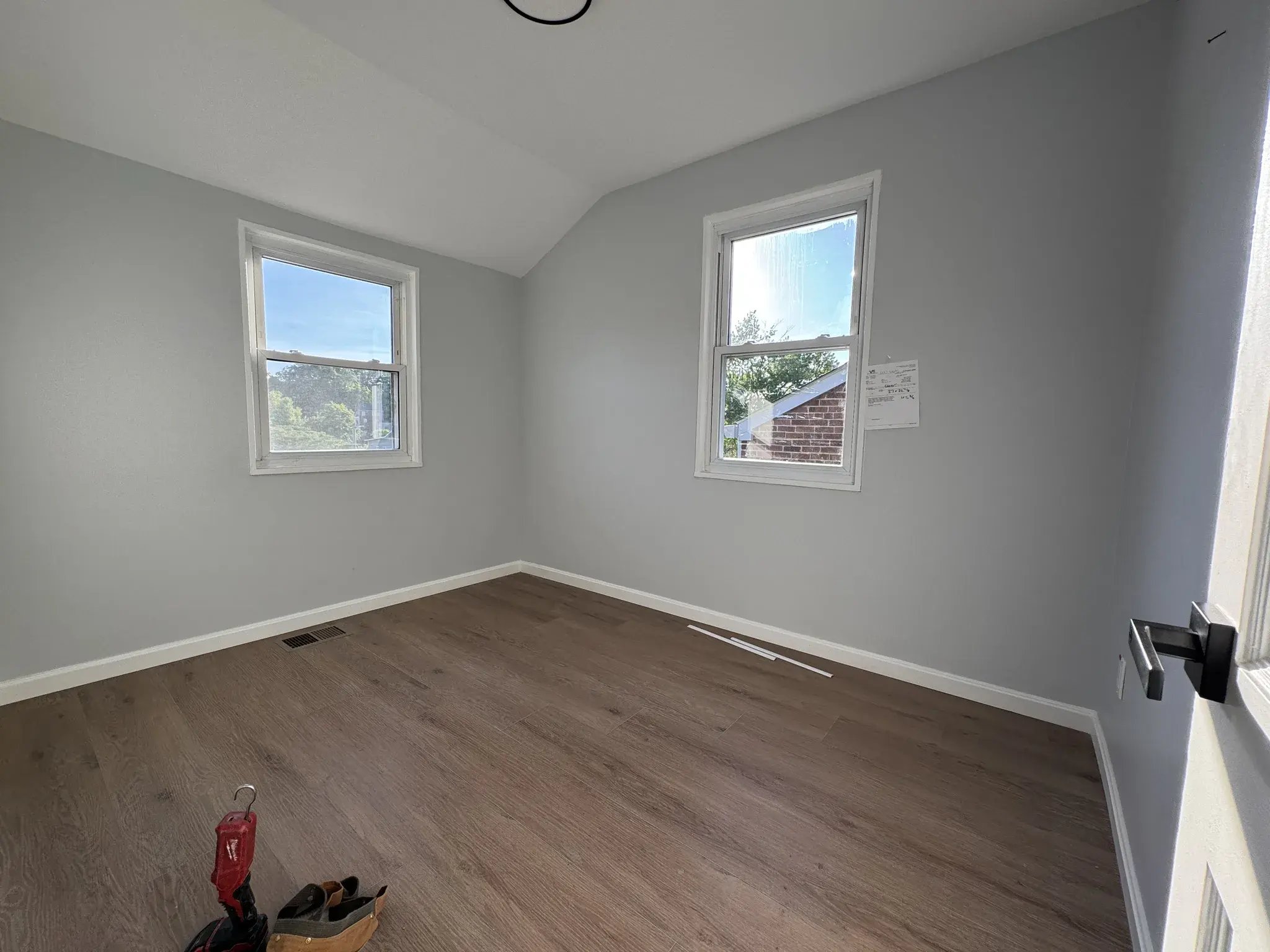 Bedroom with fresh paint and new vinyl plank flooring