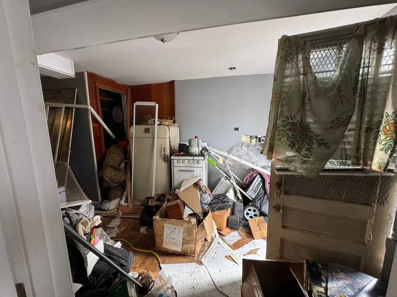 Cluttered basement before renovation