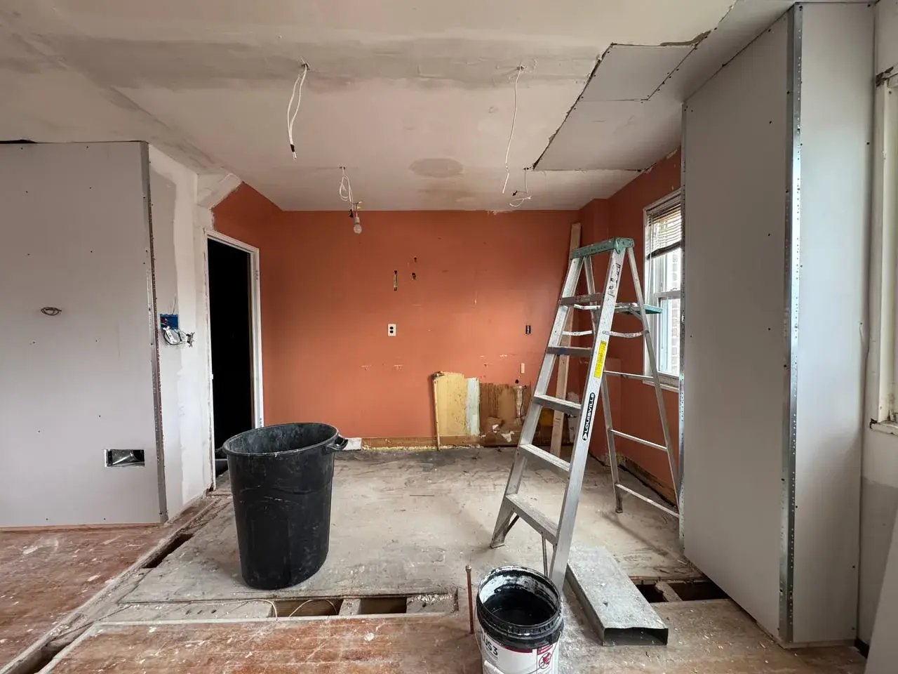 Kitchen area during drywall and ceiling repairs