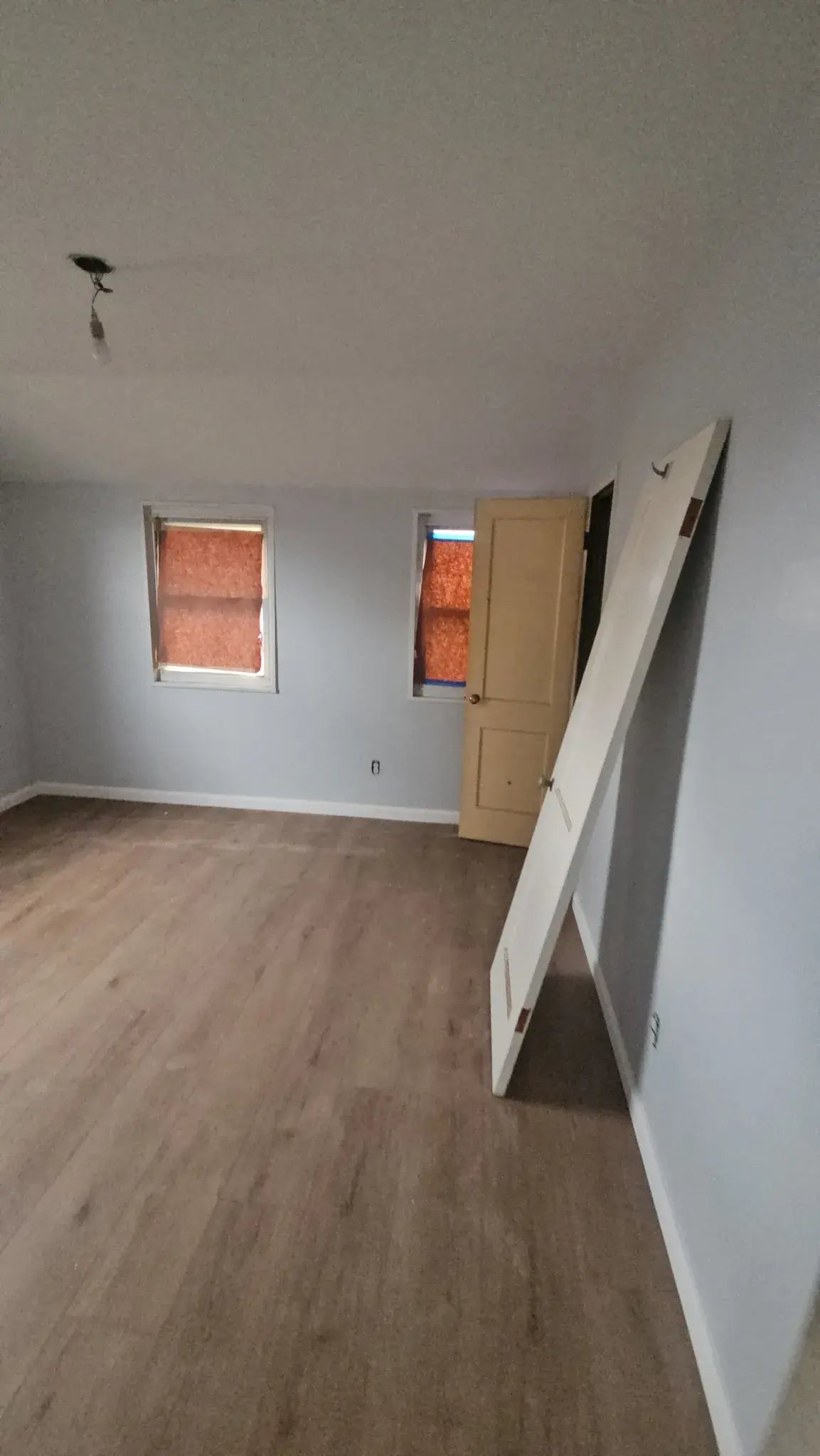 Bedroom with new vinyl plank flooring installed