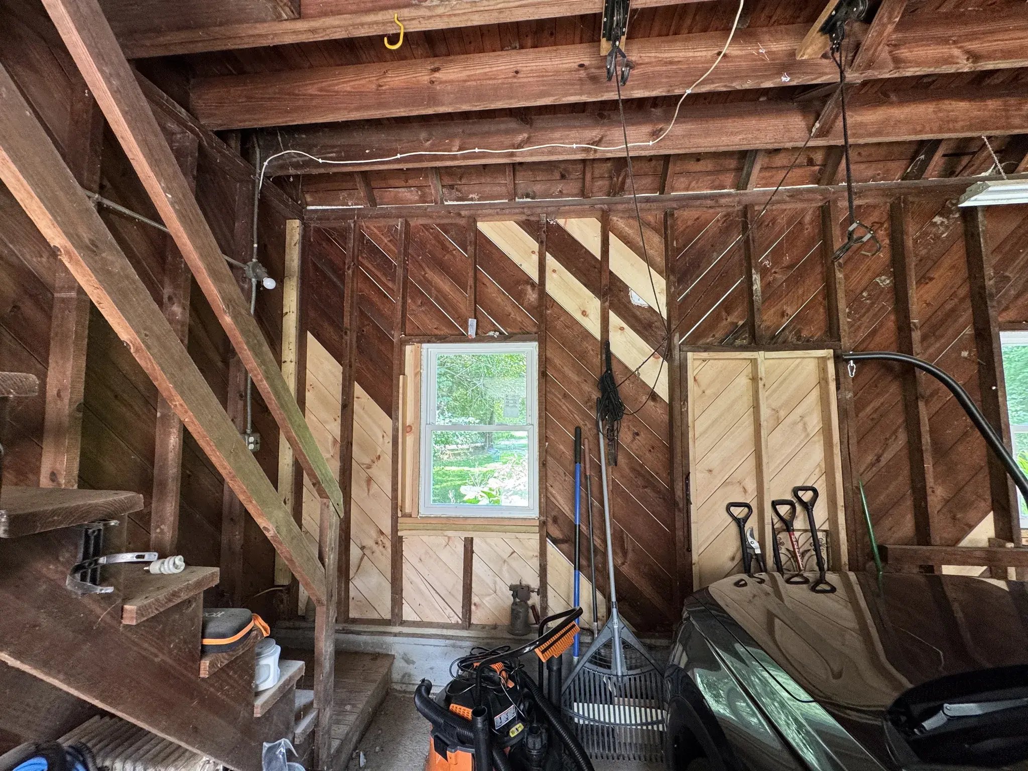 Garage interior with new window and repaired walls