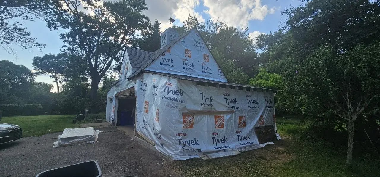 Garage wrapped in house wrap before new siding