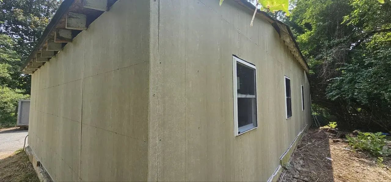 Primed fiber cement siding on the garage side wall