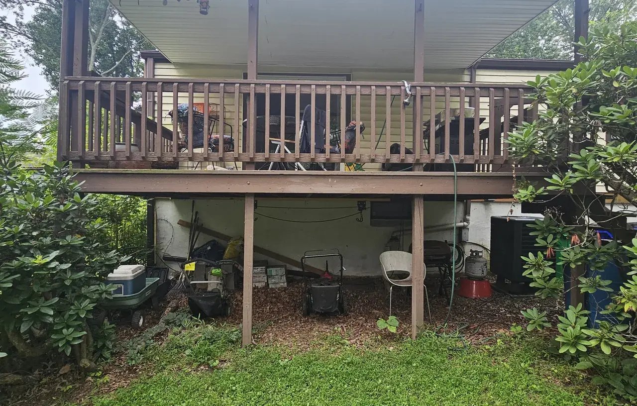 Old covered deck in Columbia, MD before replacement, view from the yard
