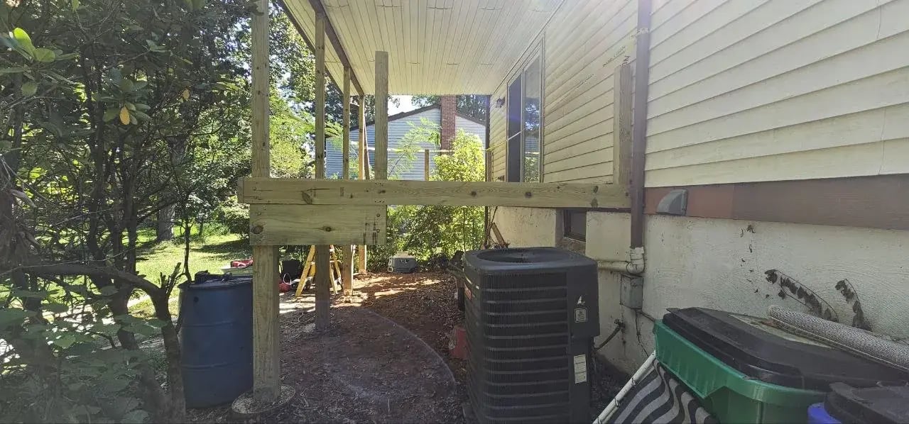 Old deck removed, roof held up by temporary posts