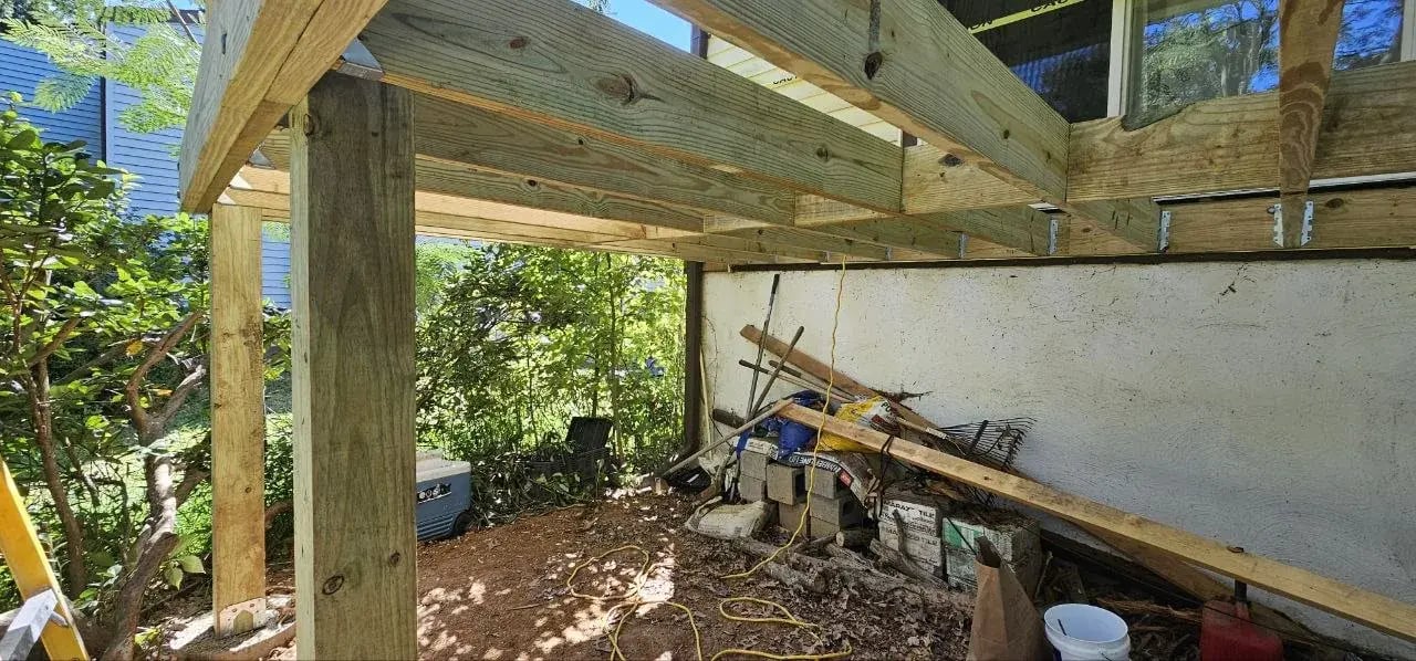 New roof beam and posts installed after deck demolition
