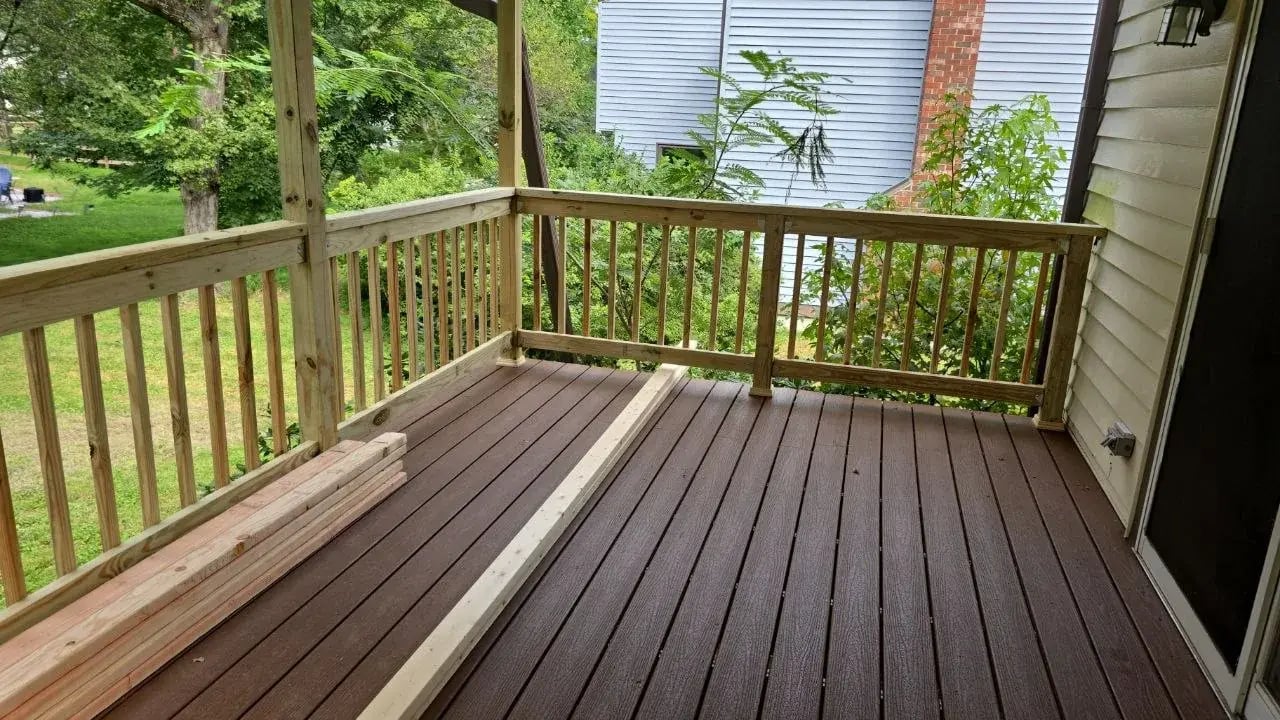 Composite decking and new railings on the covered deck