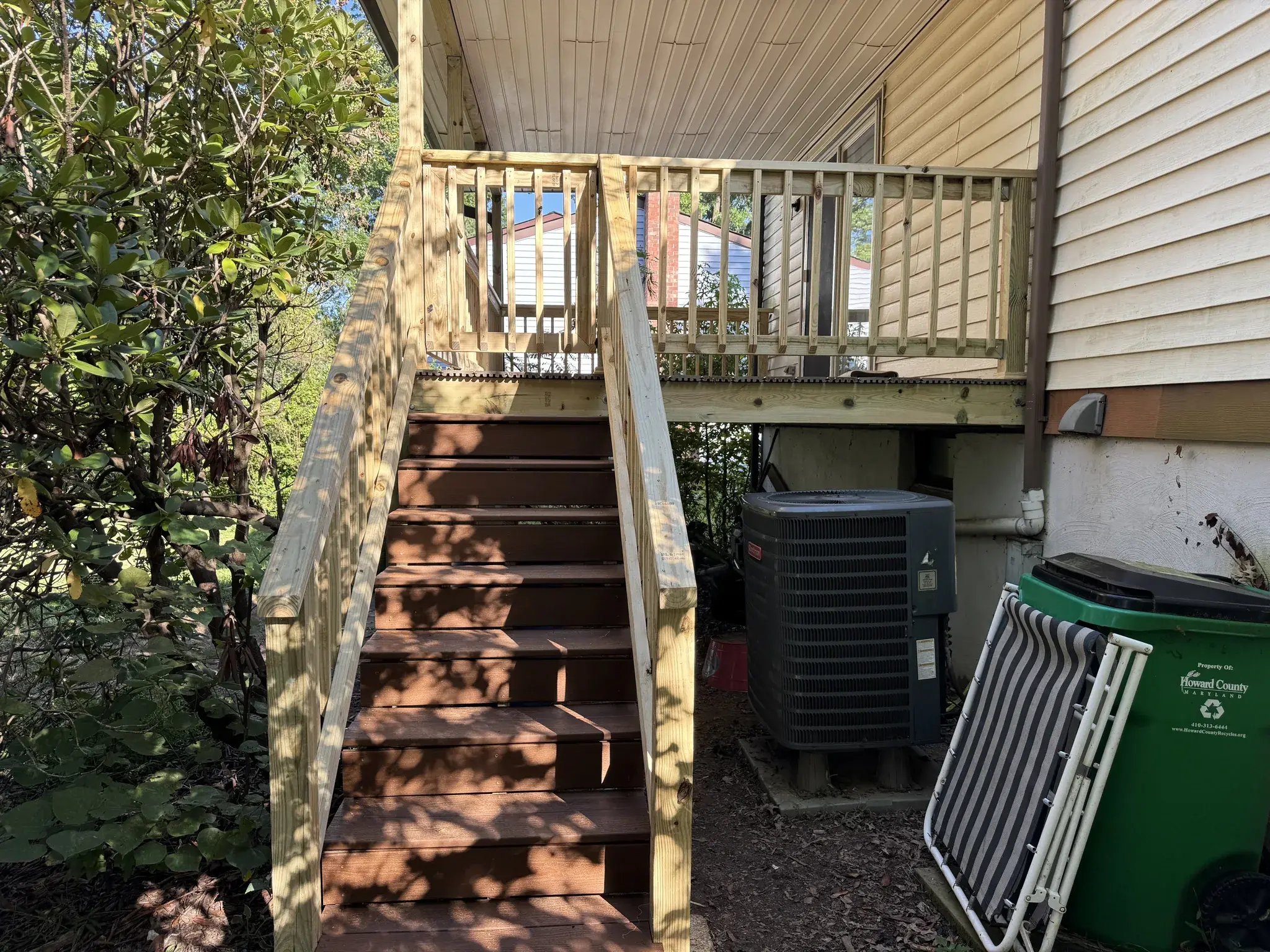 New deck stairs with composite treads and pressure-treated railings
