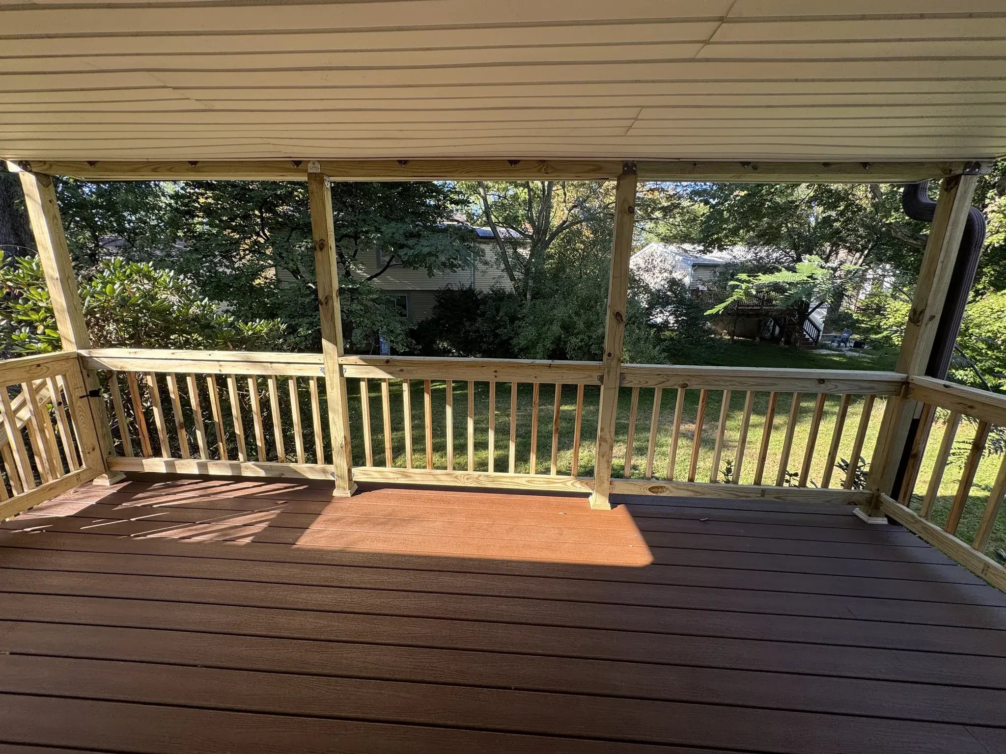 Covered deck with new railings, view toward the yard