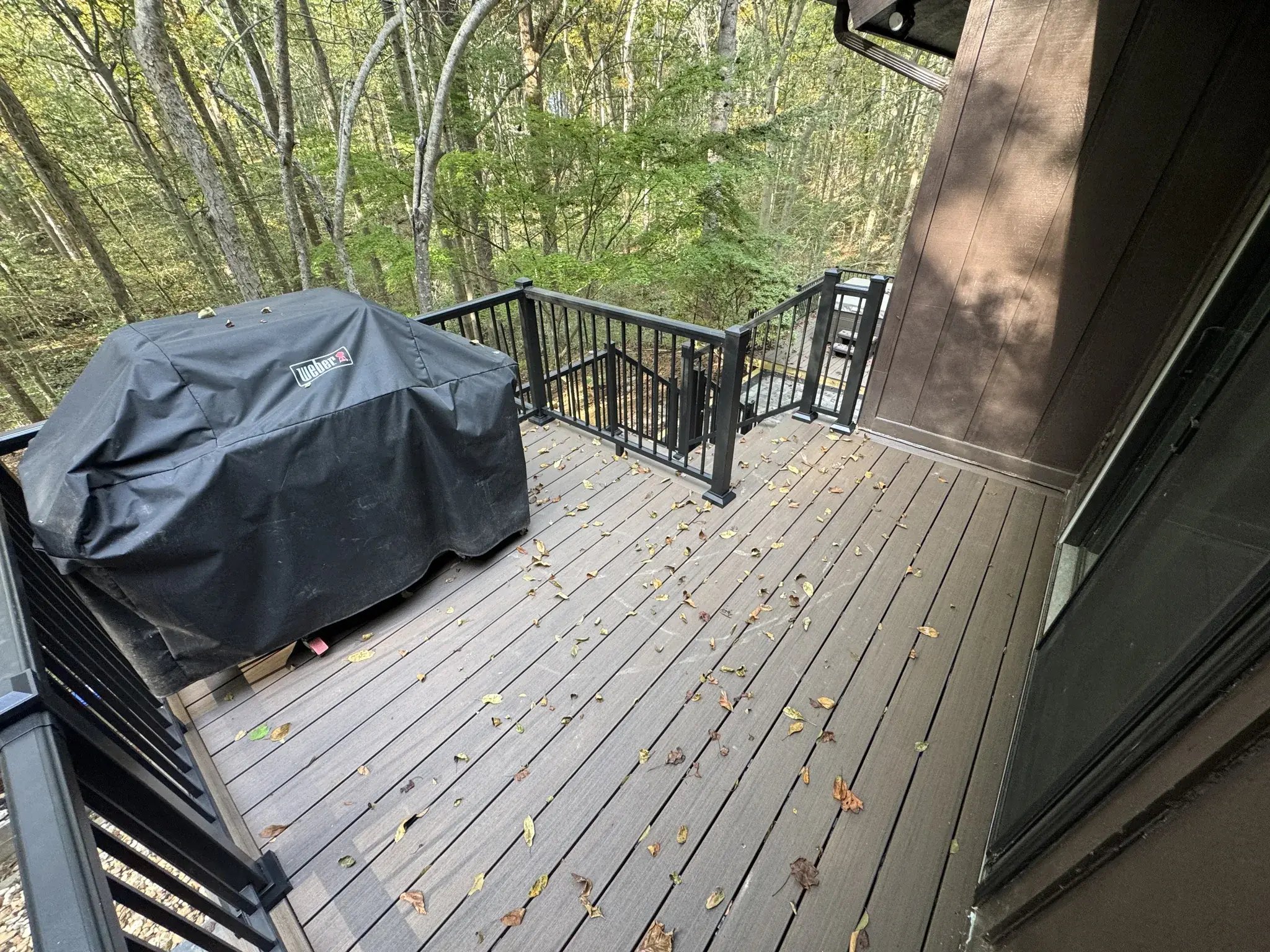 Upper deck with new composite boards and black railings