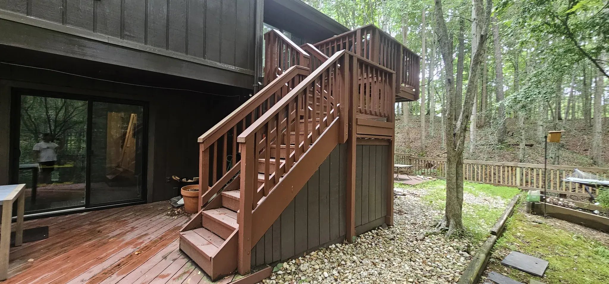 Old lower deck with wood stairs to the upper deck