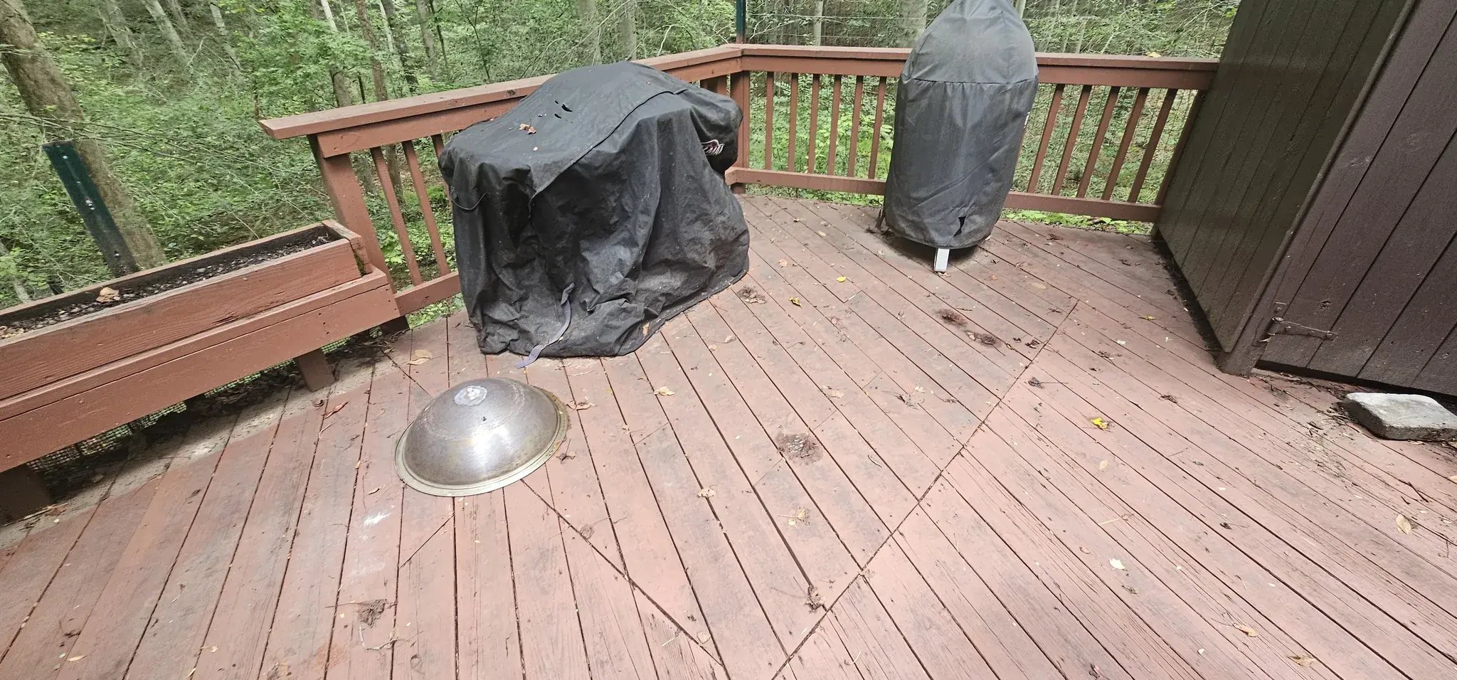 Old wood deck with faded boards before renovation