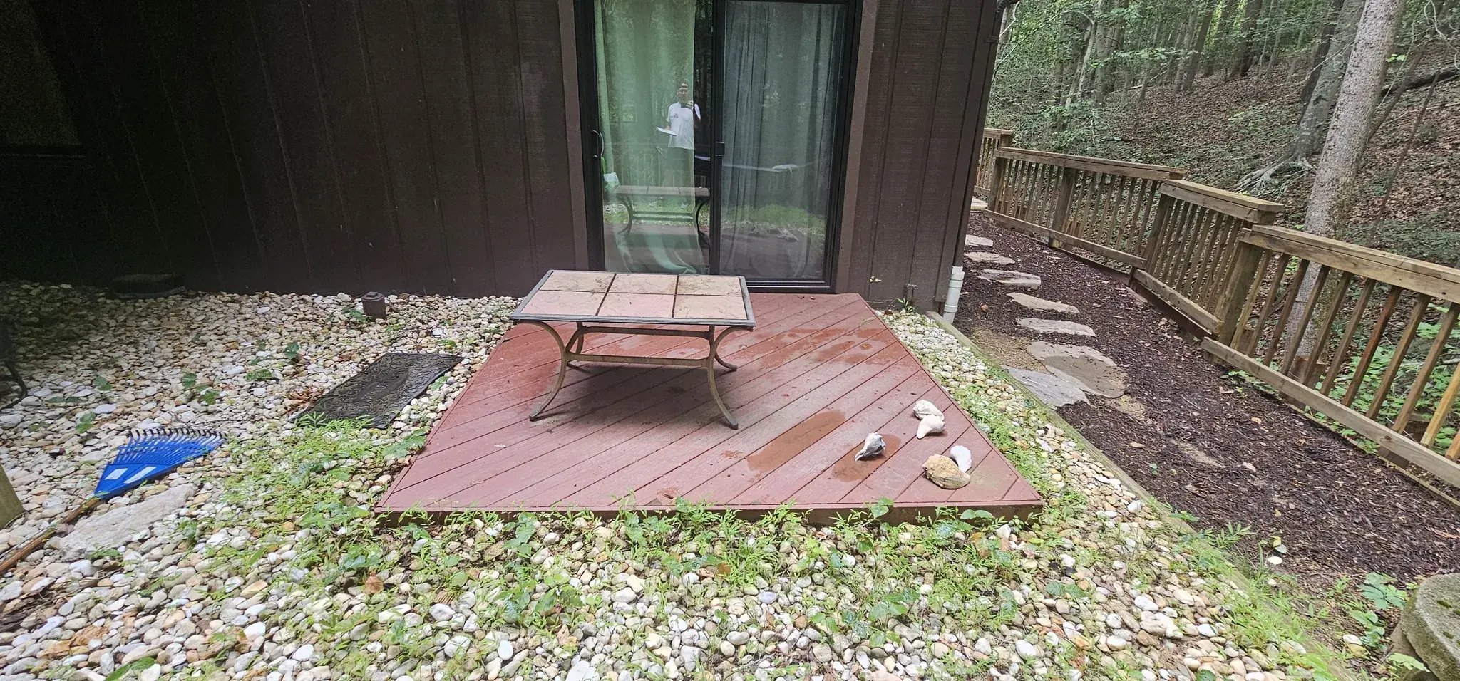 Small old wood deck at the rear sliding door