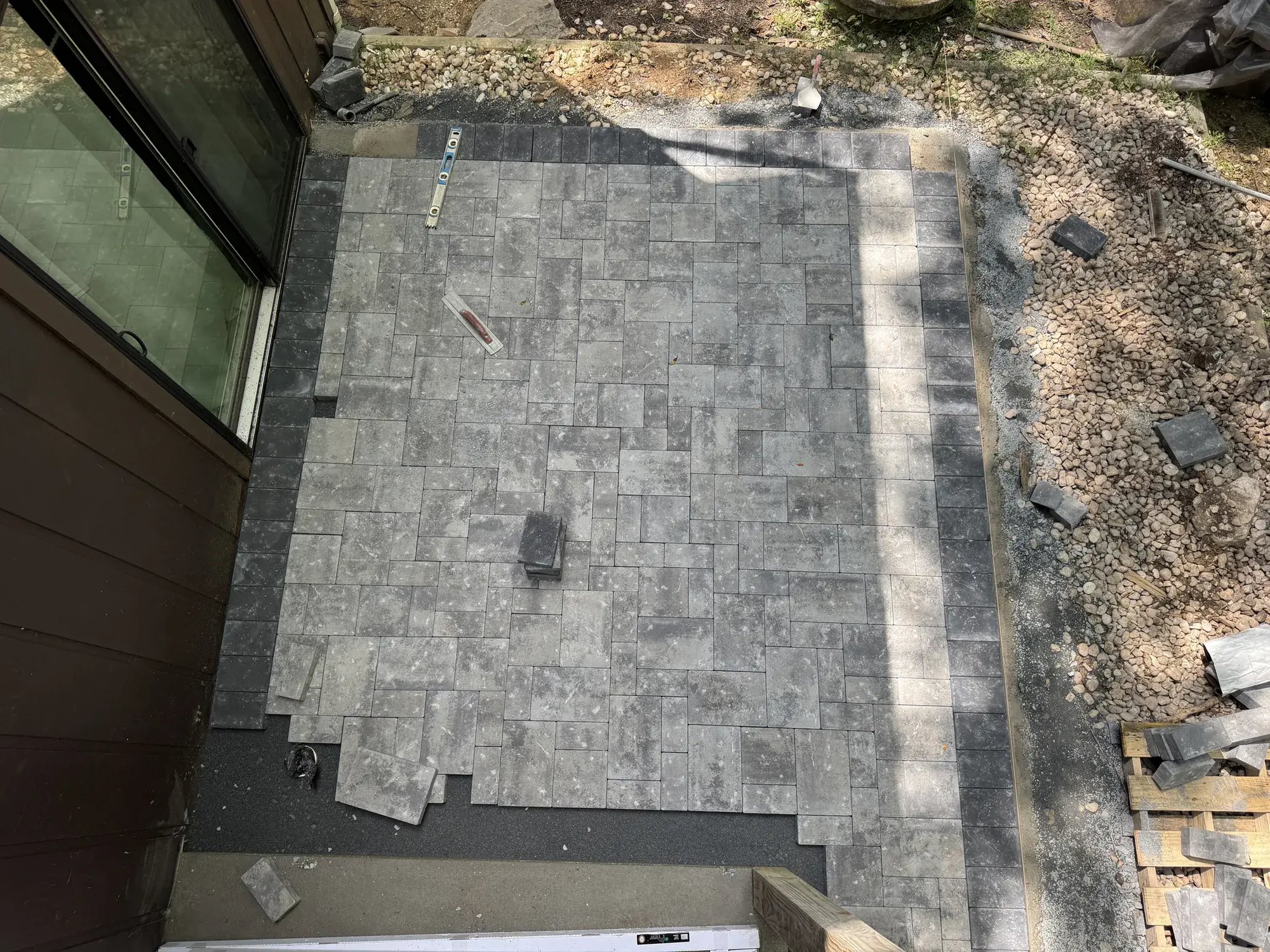Nicolock paver patio with a dark border, top view