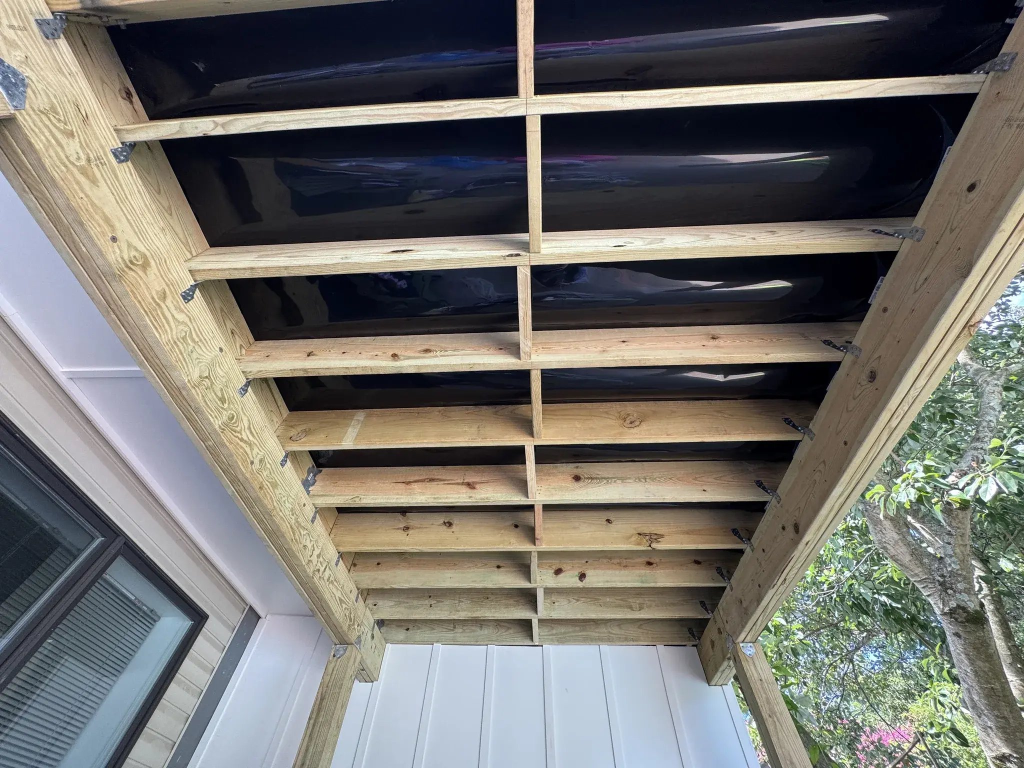 RainEscape drainage under the deck boards