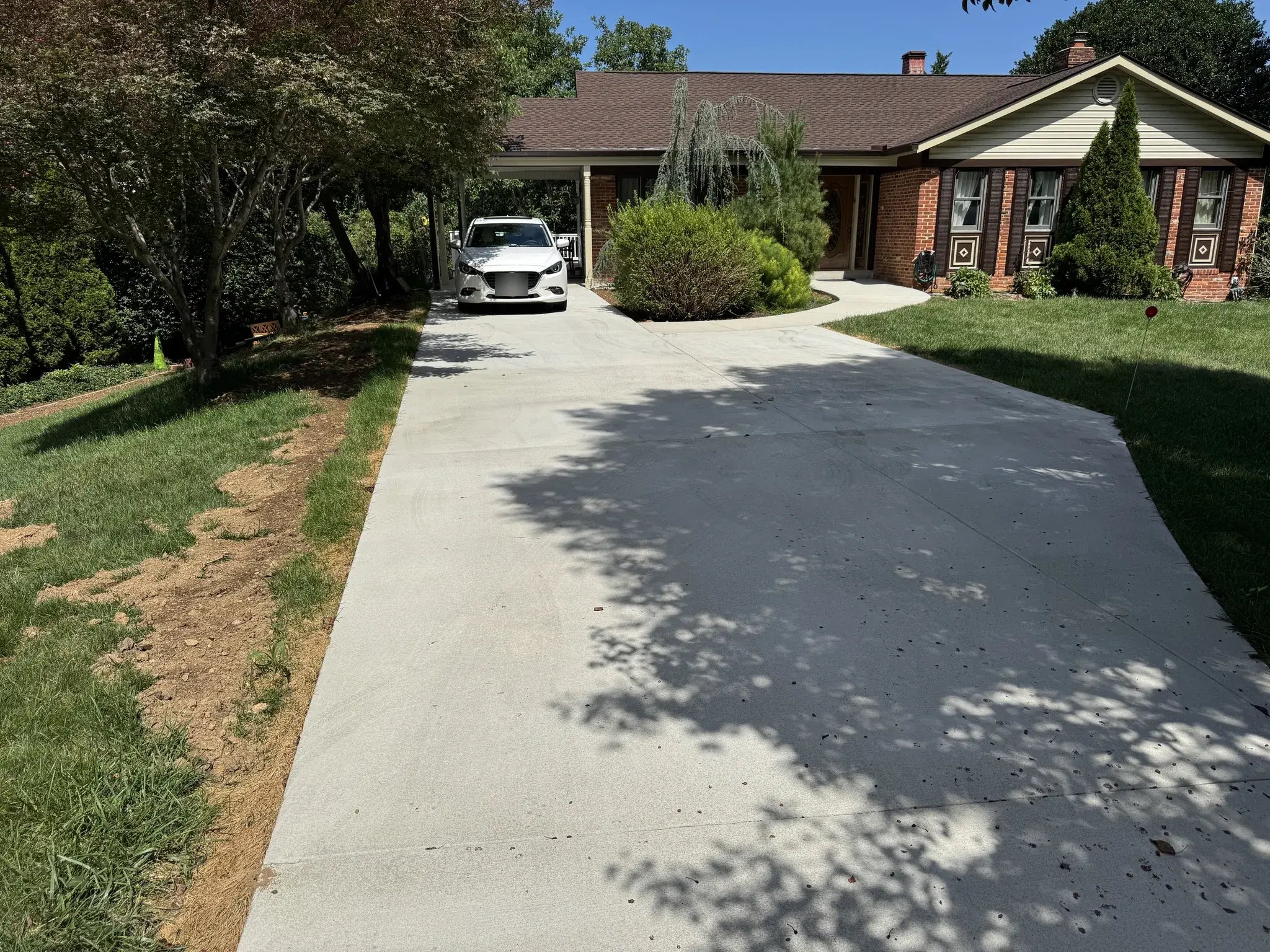 New concrete driveway leading to the house