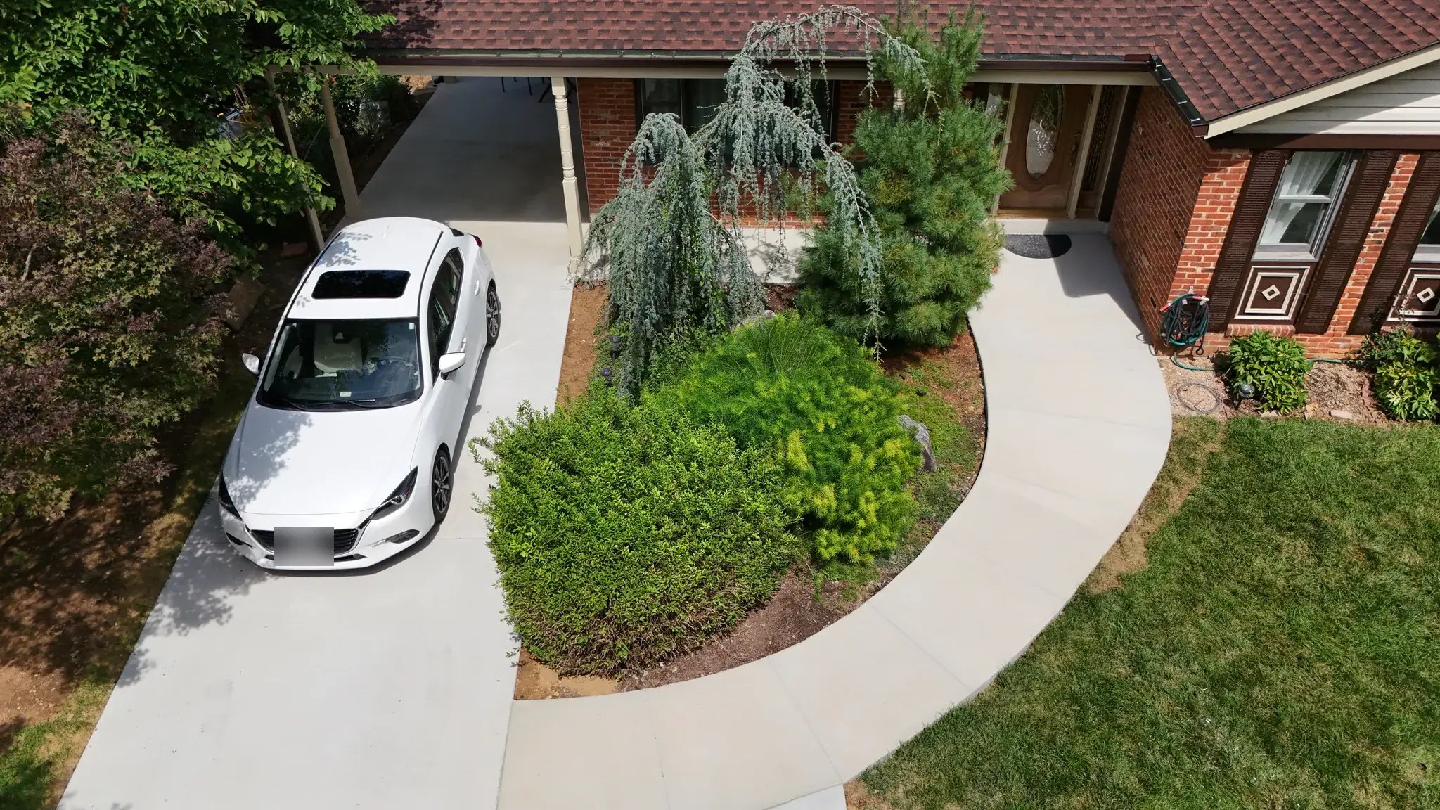 New driveway and carport slab from above