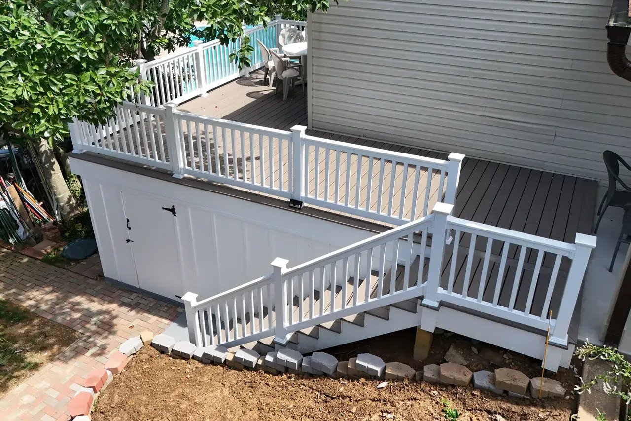 New composite deck with a storage room underneath and new stairs, aerial view