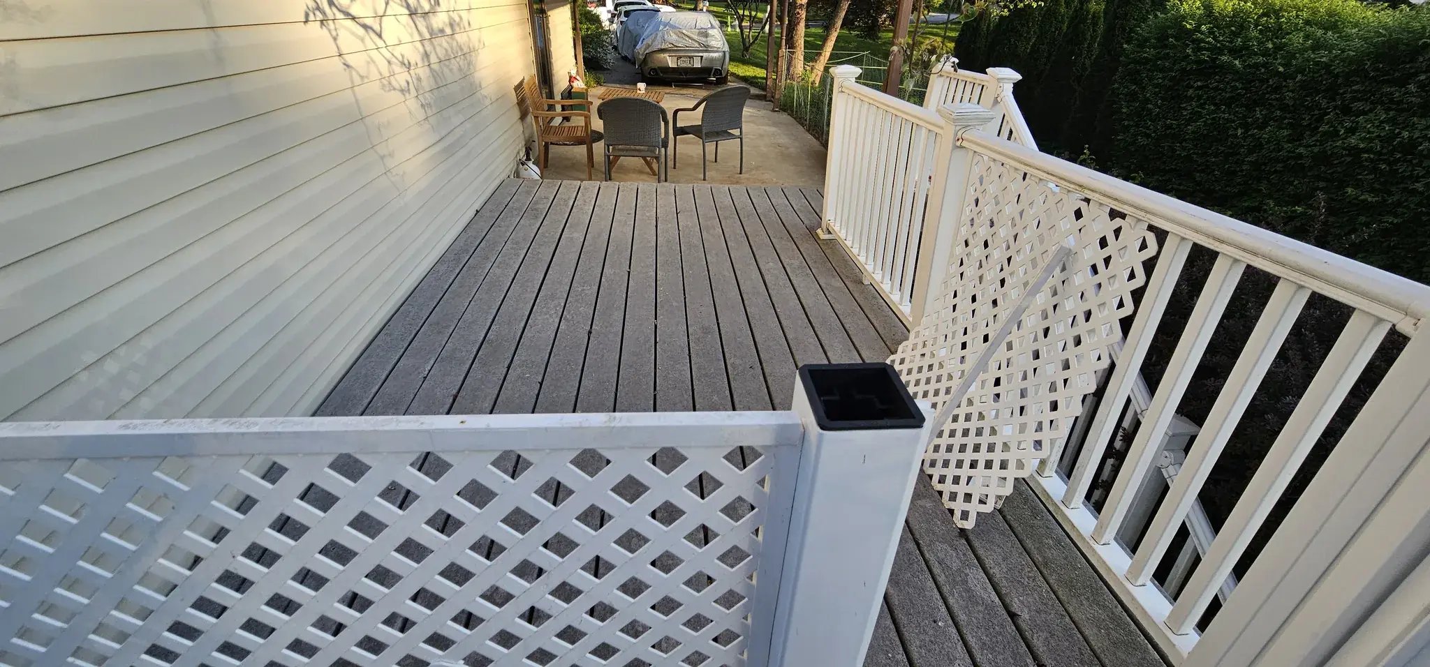 Old deck along the house with lattice panels