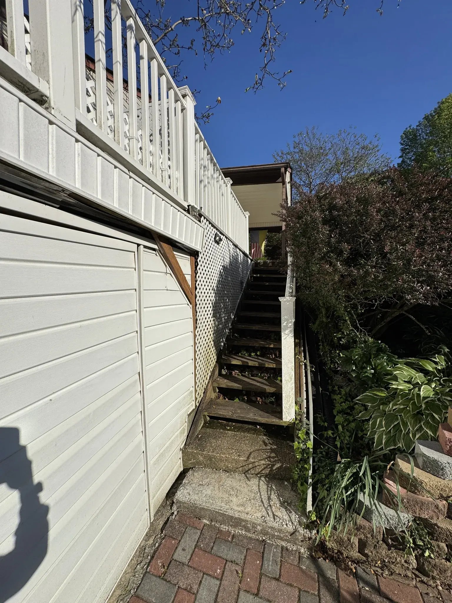 Narrow old stairs along the house