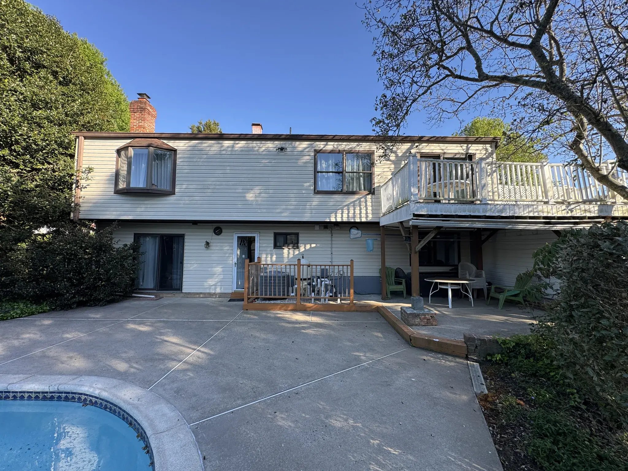 Back of the house with the old deck before renovation