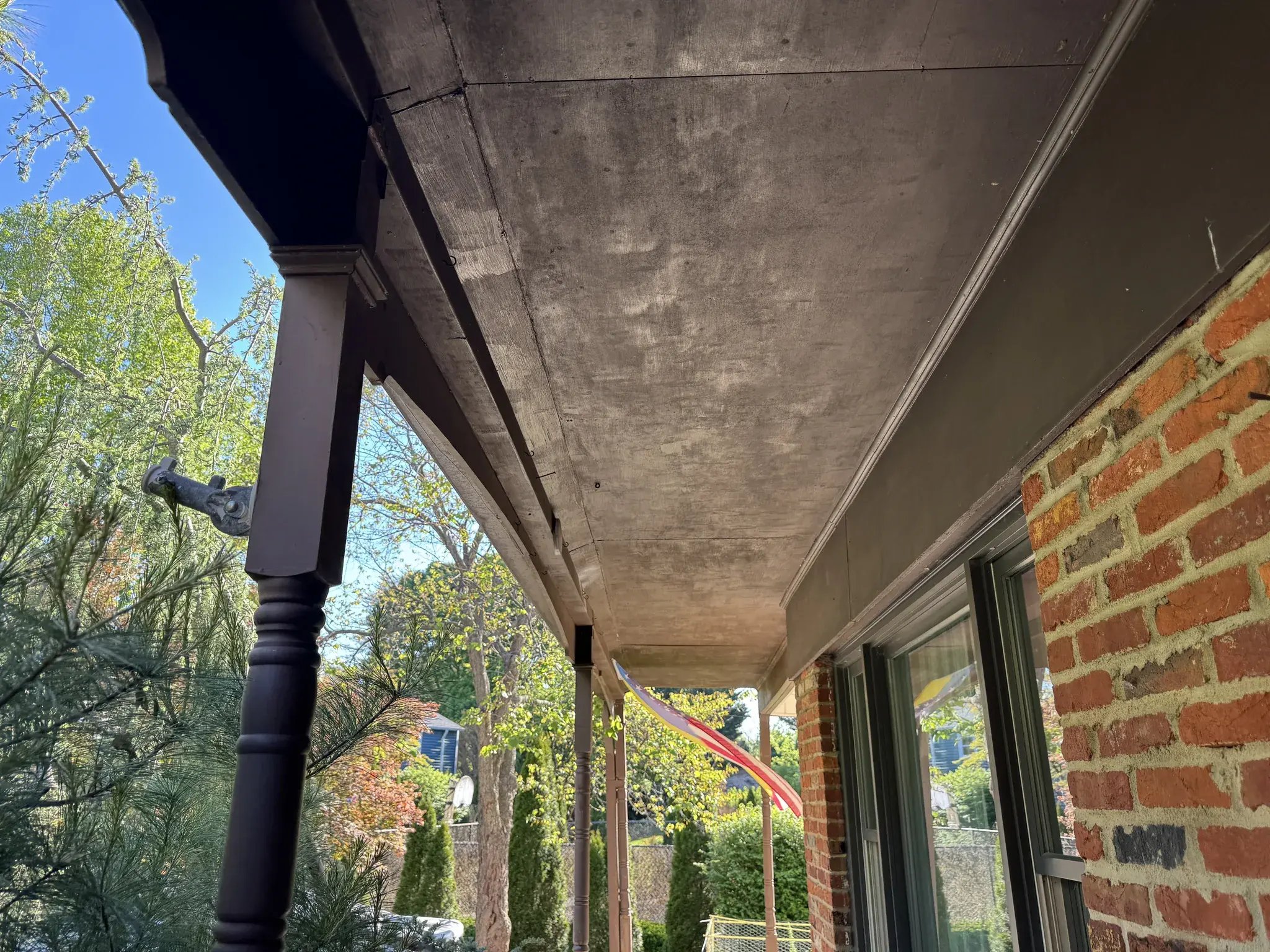 Stained old soffit under the front porch