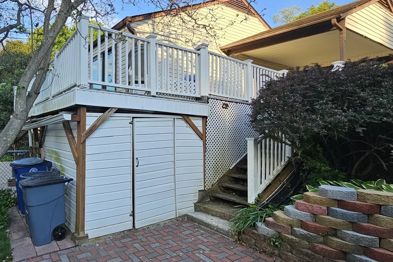 Old deck with lattice and siding storage underneath in Rockville, MD before renovation