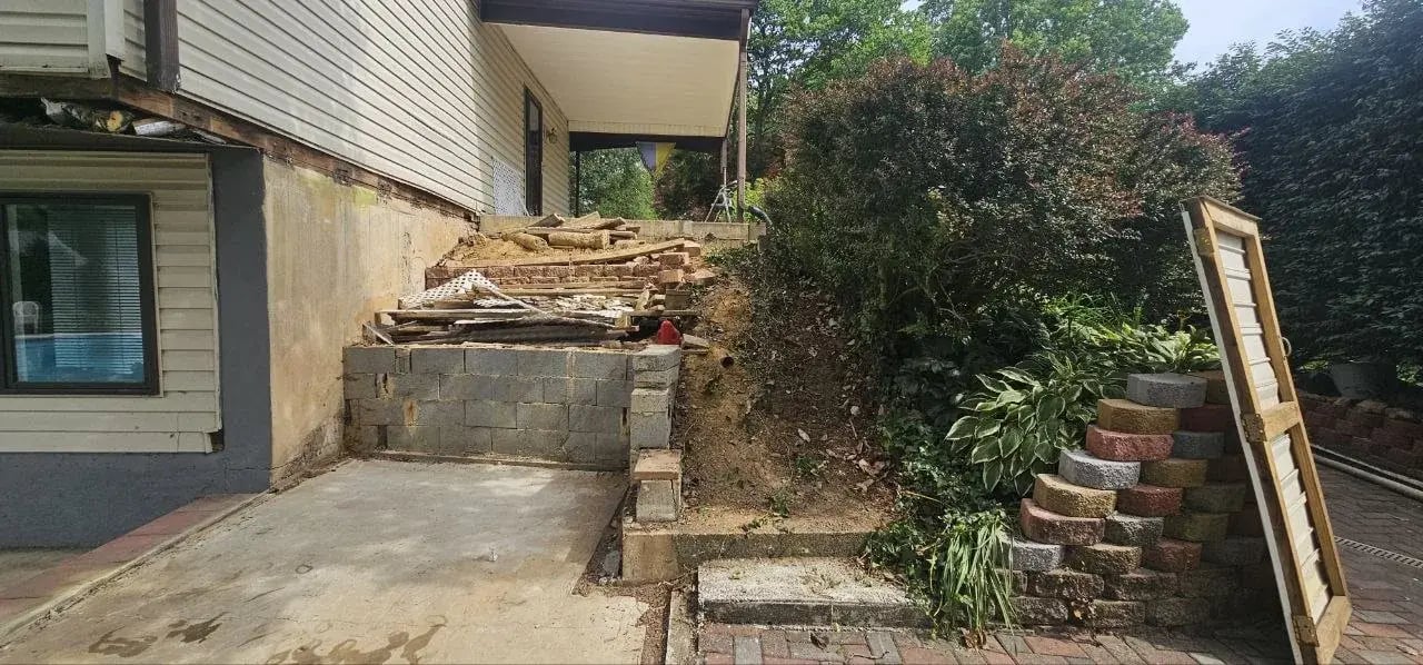 Slope under the old deck cleared for excavation