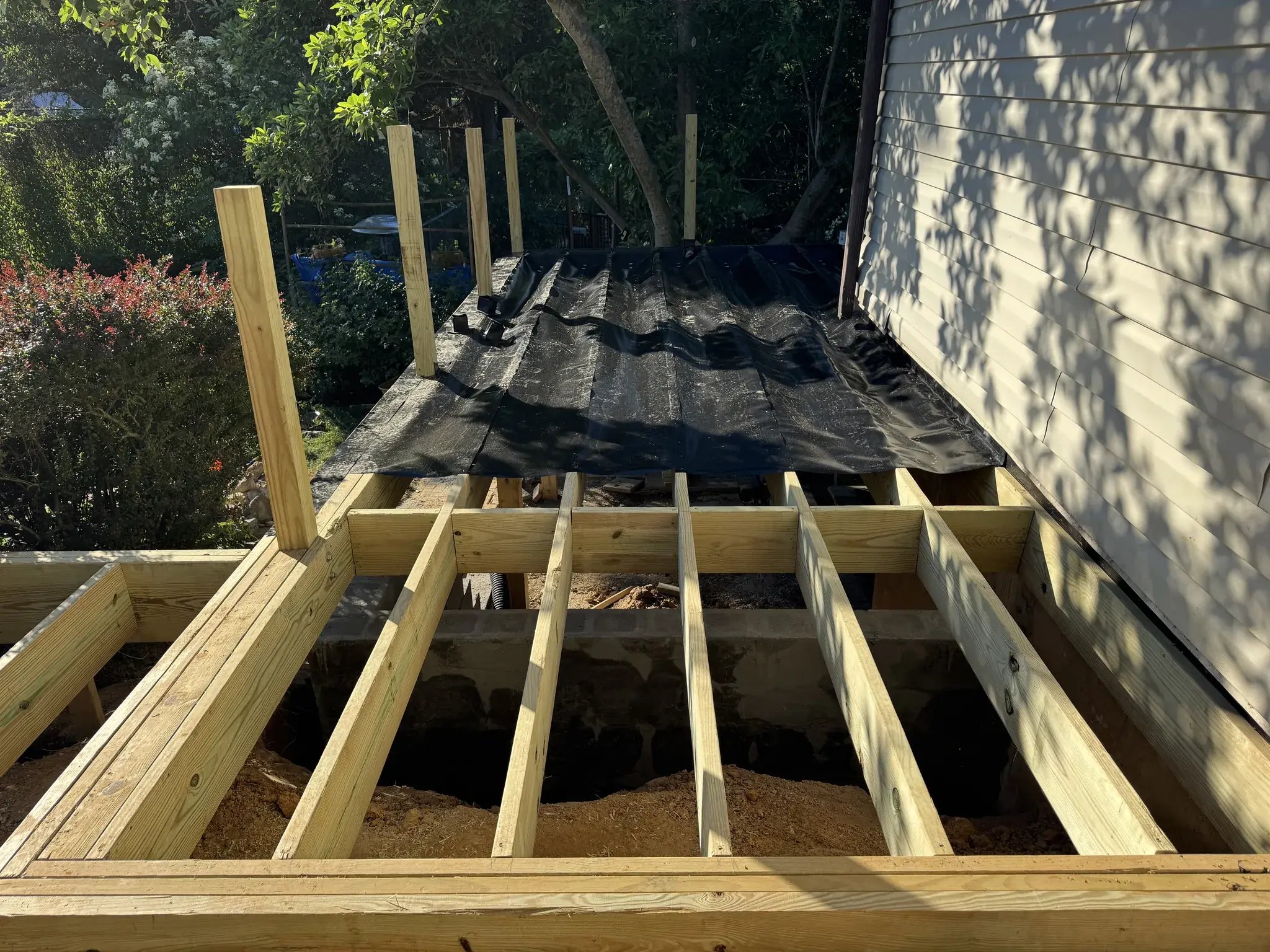 New joists with RainEscape drainage going in