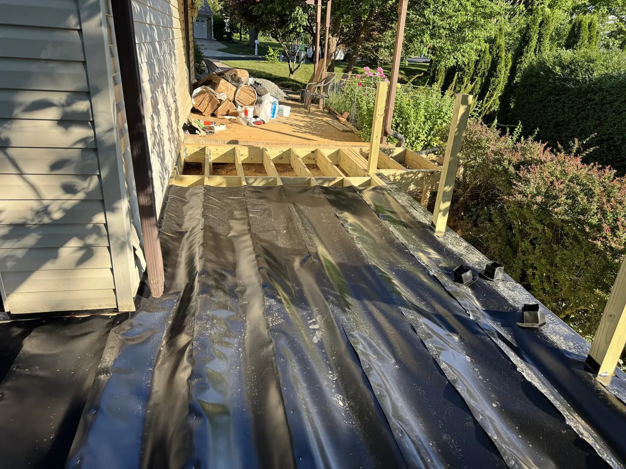 Trex RainEscape troughs installed over the joists