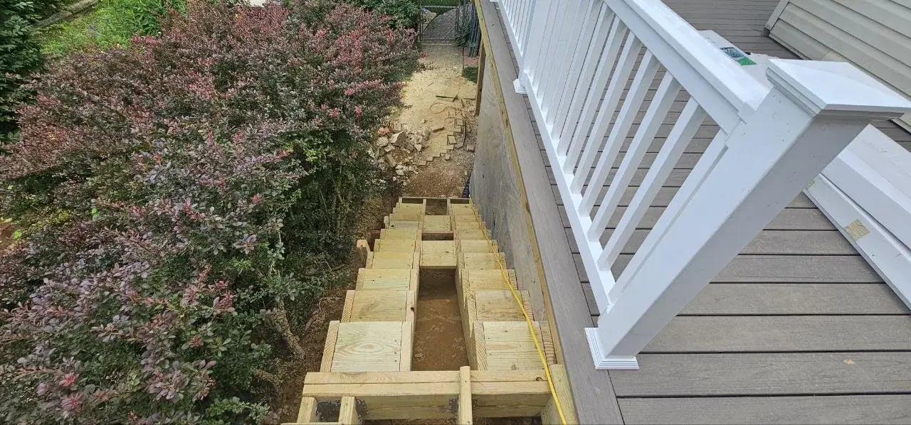 New stair framing next to the deck railing