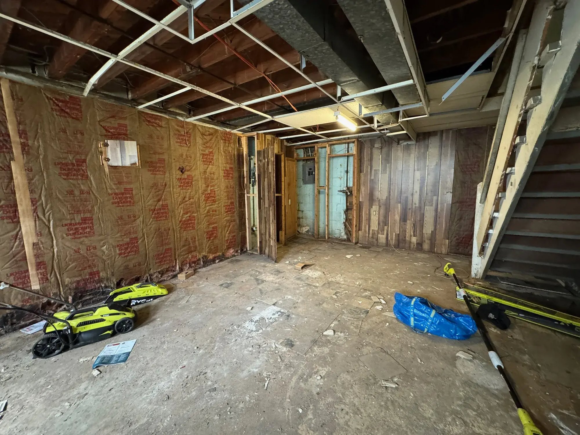 Basement stripped to framing and insulation during renovation